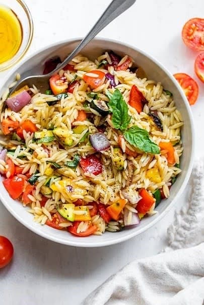 Grilled Vegetable Orzo Pasta Salad (267 calories): https://aultman.org/blog/healthy-living/grilled-vegetable-orzo-pasta-salad/#/