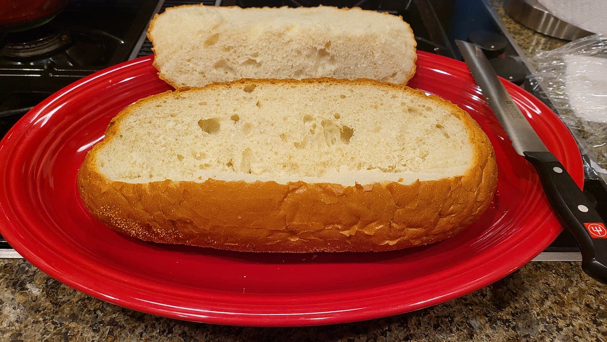 Remove 1 1/2 inch off the top of the sourdough bread, set aside.