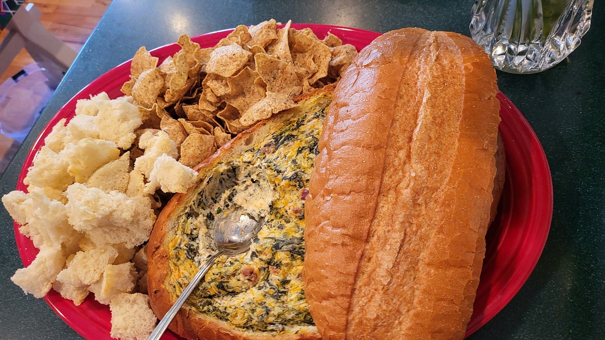 Serve warm with bread cubes/vegetables/Tostitos.