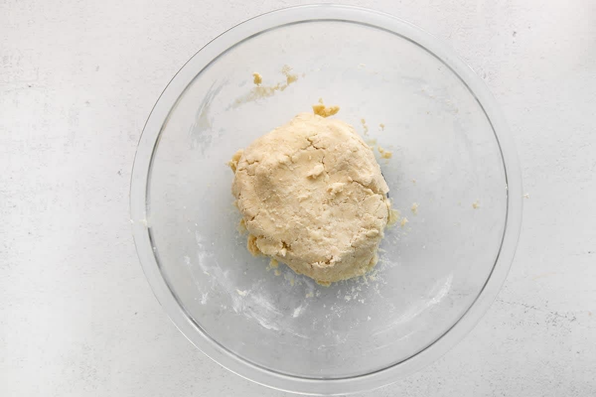 Add most of the milk and stir with the pastry knife to form a dough. Add a little more milk or more flour if needed.