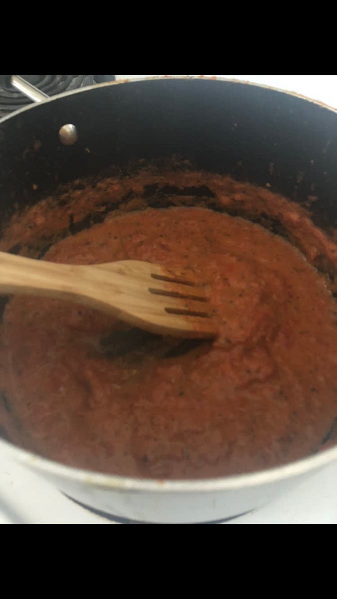 Once tomatoes reduce to a pasta sauce like consistency, add chicken broth and let simmer.