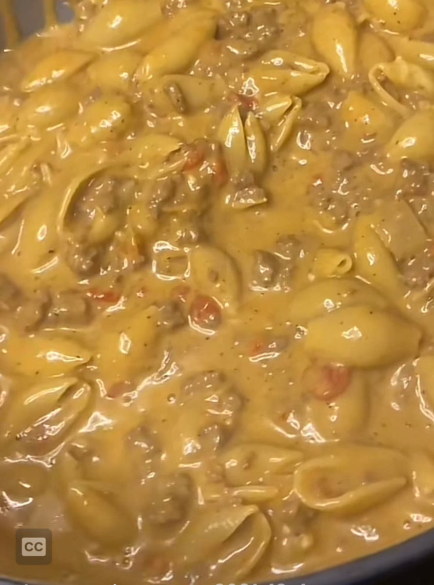 Add ground beef to pot. When half way cooked, add butter. When butter is all melted, add chopped onion. When soft, add minced garlic and Worcestershire sauce. When fragrant, add spices and can of tomatoes and chilies. Mix. Add beef broth and milk. Bring to a simmer and add shells. Cook until shells are soft. Add cheese and mix.