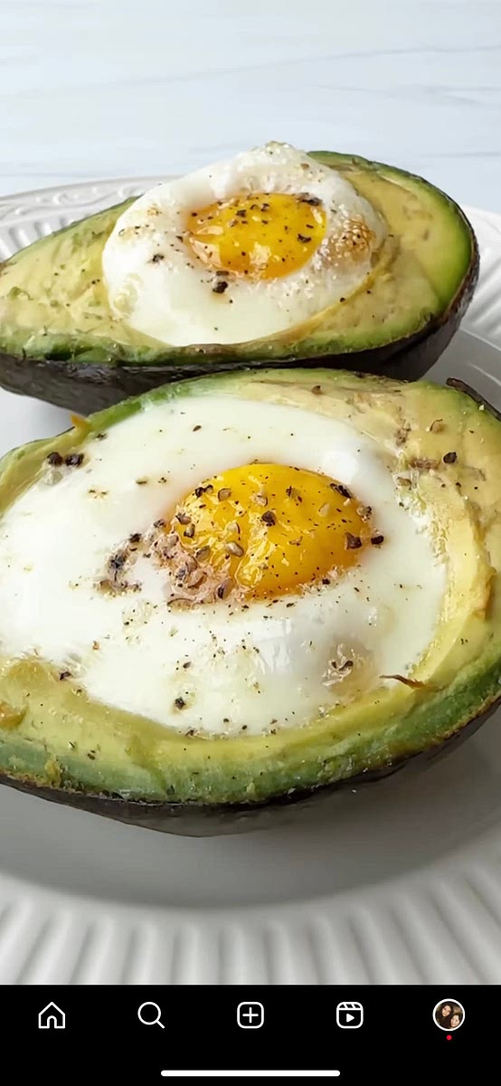 Place avocados on top of an upside-down muffin tin, and bake until egg whites have set, but yolks are still runny (about 15 minutes).