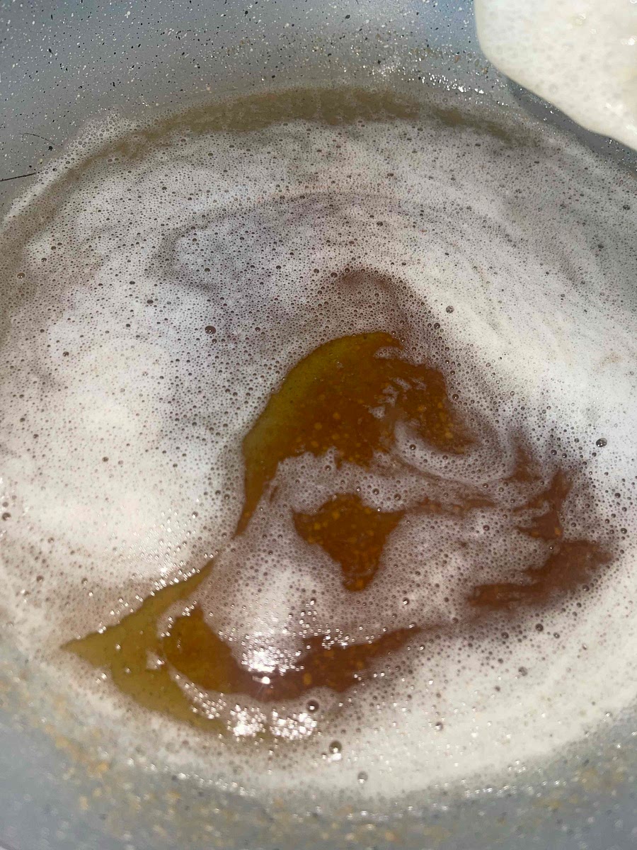 Mix the melted browned butter (once the butter is browned let it cool while you measure the sugars) and both sugars.