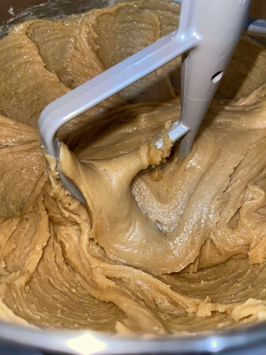 Add a little milk at a time until the dough looks smoother and softer. (use a paddle attachment)