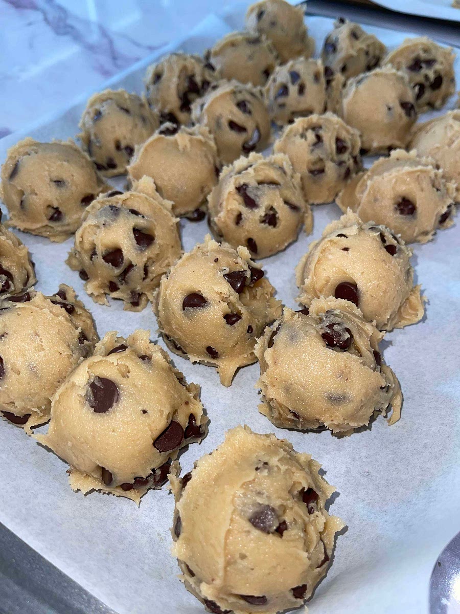 Scoop the dough into golf ball size balls and place on silicone baking mat on a pan or parchment paper.