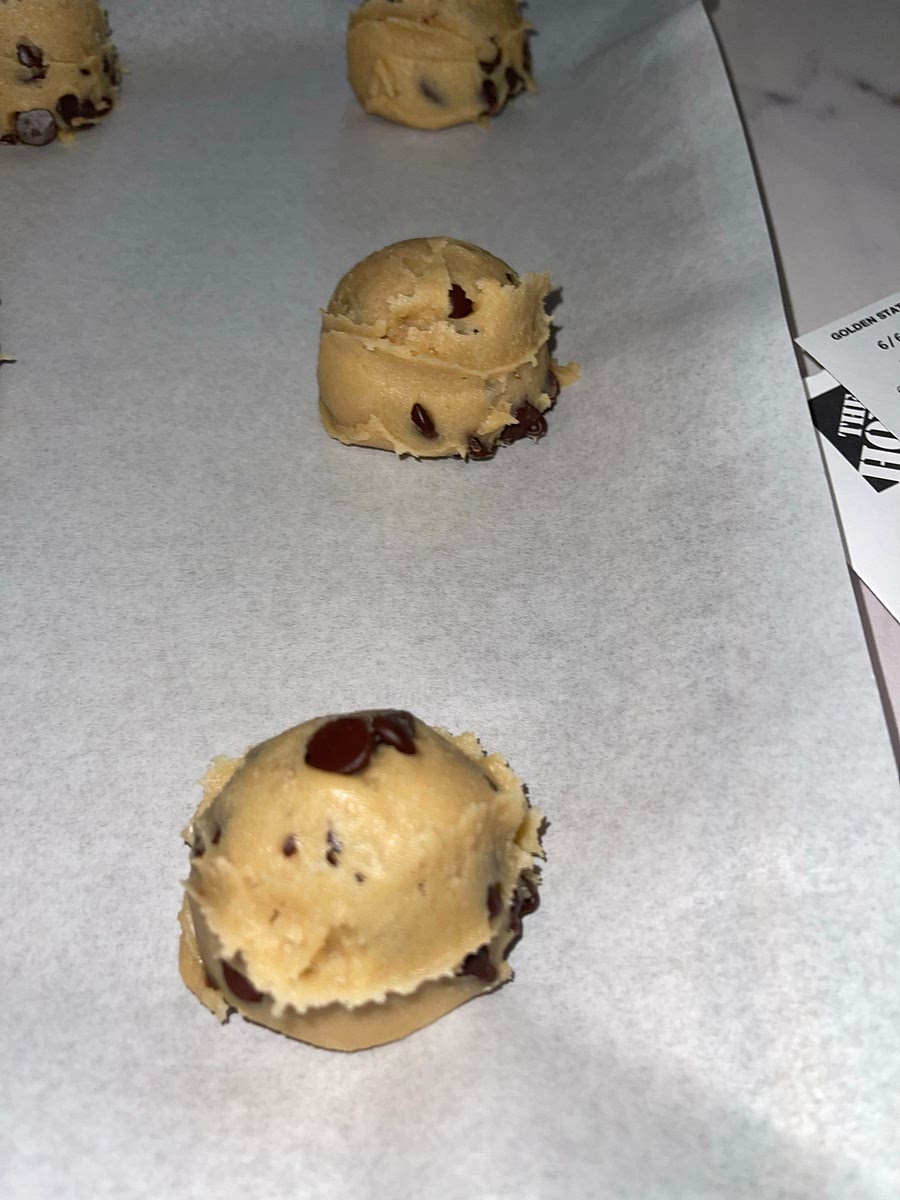 Scoop the dough into golf ball size balls and place on silicone baking mat on a pan or parchment paper.