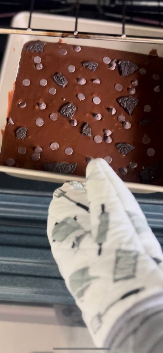 Put the baking pan in the preheated oven and bake for 24-26 minutes. Check for doneness by inserting a toothpick into the center. If it comes out clean or with a few crumbs, the brownies are ready.