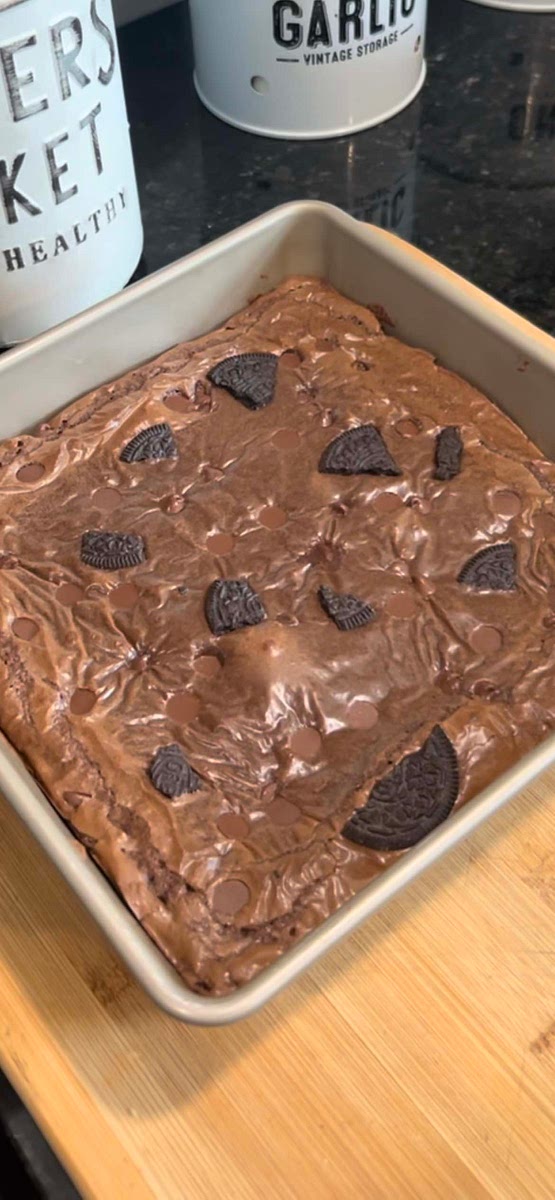 Once baked, remove the pan from the oven and let it cool for a few minutes. You can then cut the brownies into squares and serve.