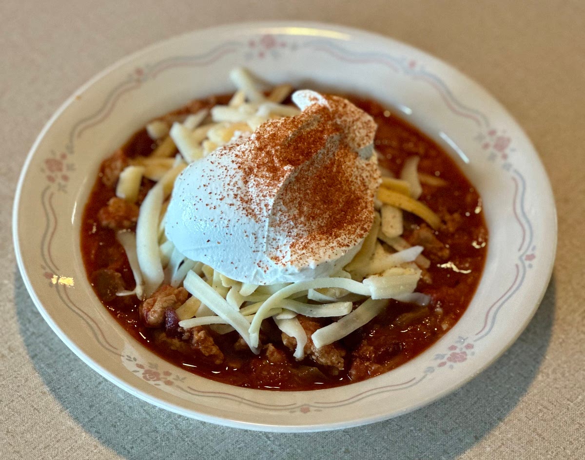 Serve topped with 2-3 tbsp melted shredded cheddar and 2-3 tbsp of sour cream. Add extra chili powder if desired. (Organic Carolina Reaper chili powder is an amazing addition!)