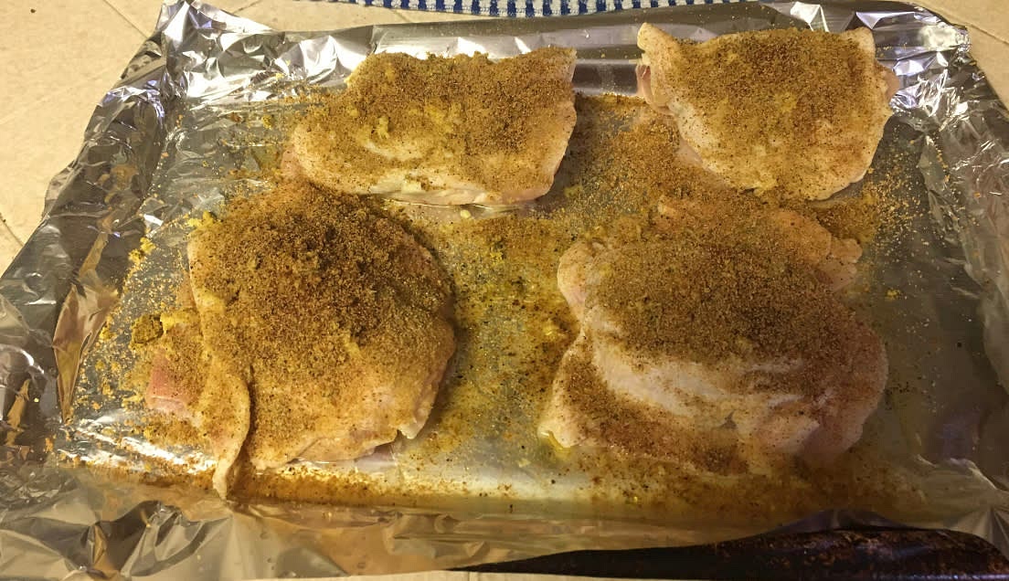 Season the chicken thighs with cumin, lemon pepper, seasonall, garlic salt, black pepper and paprika. I apply the cumin, lemon pepper and seasonall the heaviest.