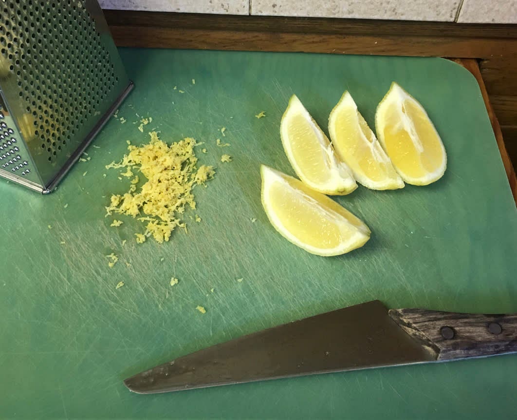Slice each of the zested lemons into four wedges.
