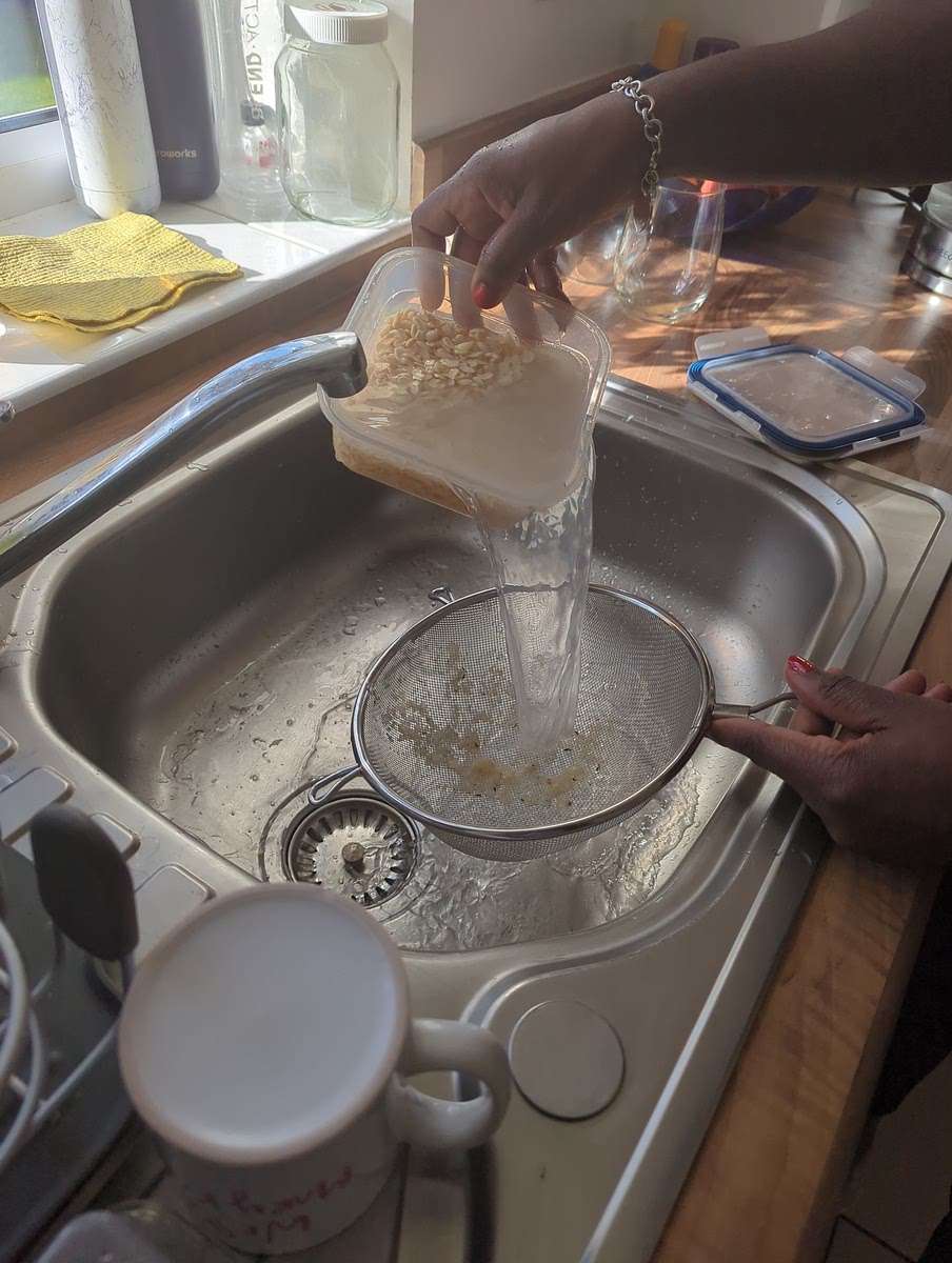 Wash the beans by filling bowl with water and sieving out the skin until water runs clear. Leave 2 tbsp of water