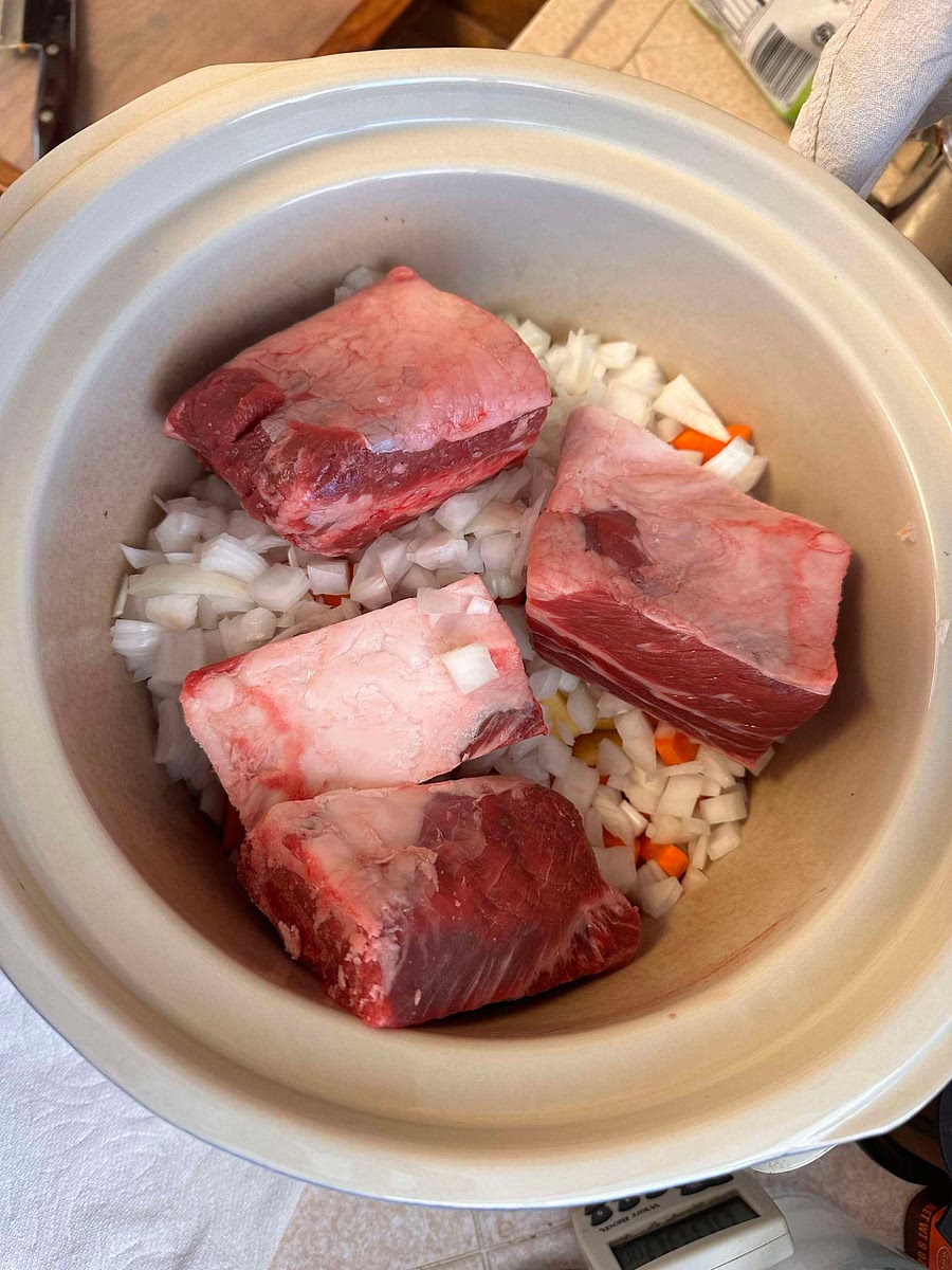 Scrub the potatoes and carrots and cut them into small 1” chunks.