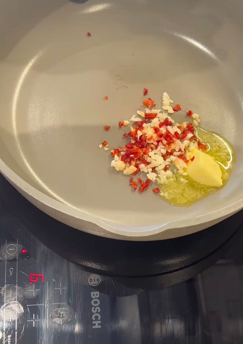 Soften garlic & chillis with butter