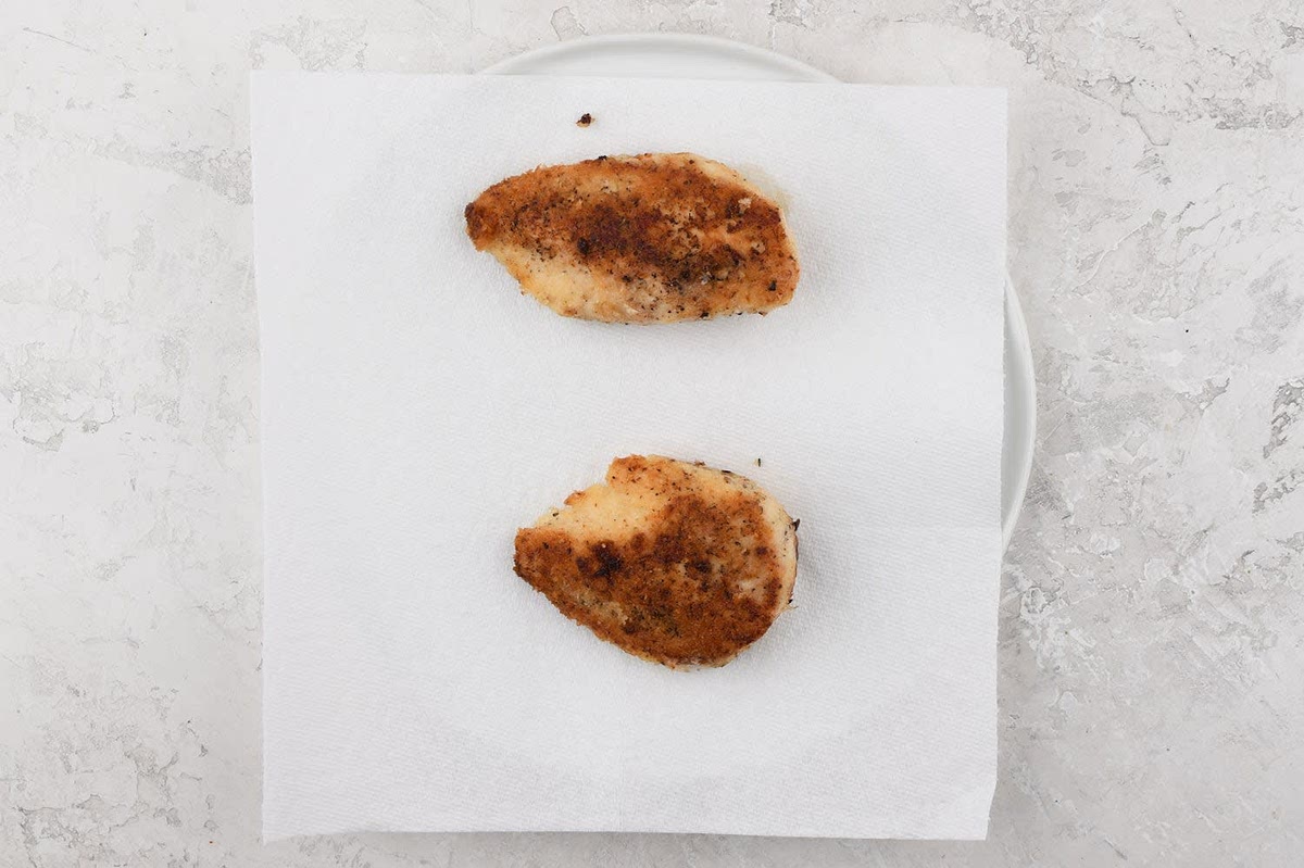 Line a plate with a paper towel. Pat chicken dry and season both sides with 1/4 tsp. salt and a pinch of pepper. Evenly spread panko on a plate. Place chicken onto panko and flip until coated on both sides, pressing gently to adhere. Place a medium non-stick pan over medium-high heat and add 2 tsp. olive oil. Add chicken to the hot pan and cook undisturbed until browned, 3-5 minutes. Lower heat to medium. Flip chicken and cook until chicken reaches a minimum internal temperature of 165 degrees, 3-5 minutes. Cutlet thickness can vary; if you receive a thinner cutlet, we recommend checking for doneness sooner. Remove from burner. Transfer chicken to towel-lined plate. Wipe pan clean and reserve. While chicken cooks, continue recipe