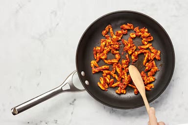 • Add tomato paste, curry powder, and paprika to pan with chicken. • Cook, stirring, until chicken is fully coated and spices are fragrant, 1 minute.