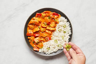 • Fluff rice with a fork and season with salt and pepper; divide between bowls. • Top rice with coconut curry chicken.