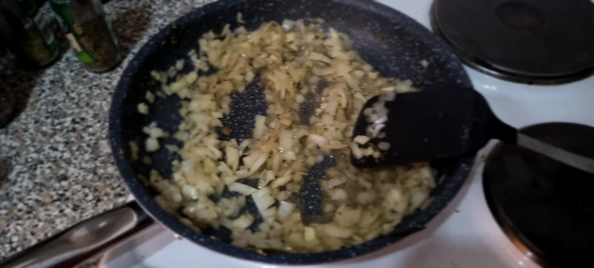 Add the chopped onion and garlic to the pot and sauté over medium heat until soft and lightly browned. I recommend adding a splash of water to loosen all the sticky bits from the bottom of the pot.