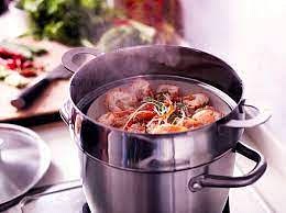 Add the oil to the skillet and set over medium heat. Add a good pinch of salt. Sauté the shrimp heads to release their flavor into the oil, cooking until they are red and crispy. Then turn off the heat.