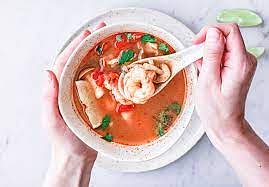 Remove and discard any tough sections of lemongrass. (Keep them all in if the stalks are soft.) Increase the heat to high. Stir in the mushrooms. Boil for 1 minute. Then stir in the shrimp and fish sauce, cooking until the shrimp are just cooked through, about 45 seconds.