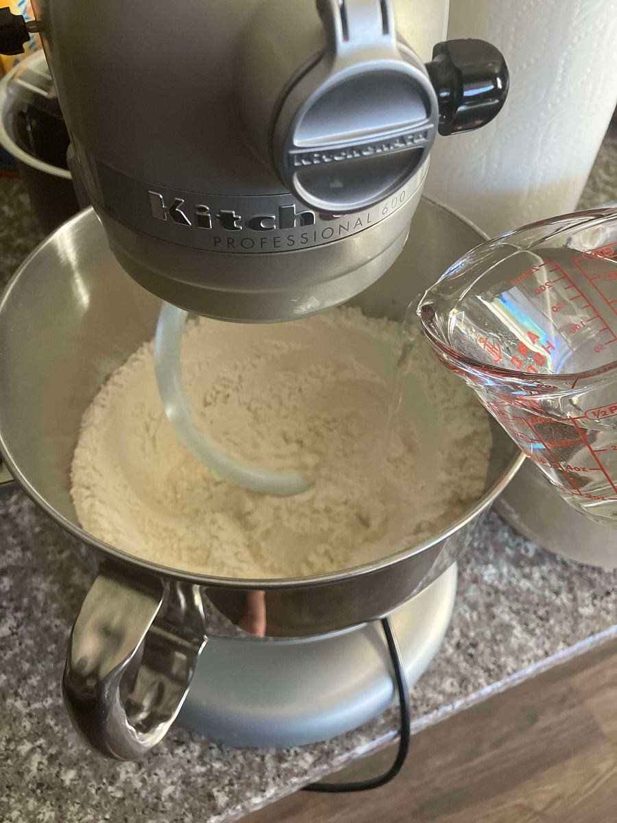Slowly add water to the dry ingredients