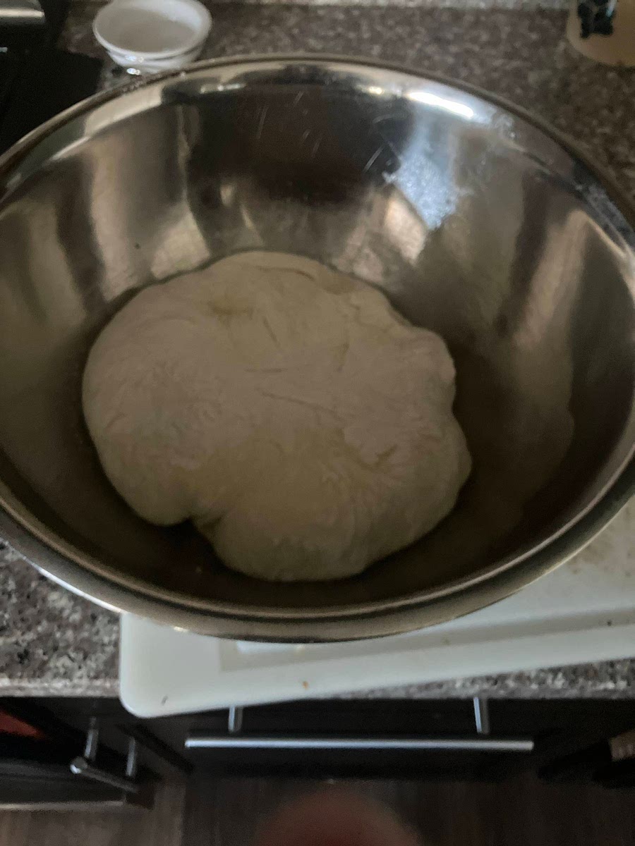 Move kneaded dough into clean greased bowl