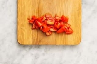 Wash the baby spinach. Wash and cut tomatoes into 1/4 inch pieces.
