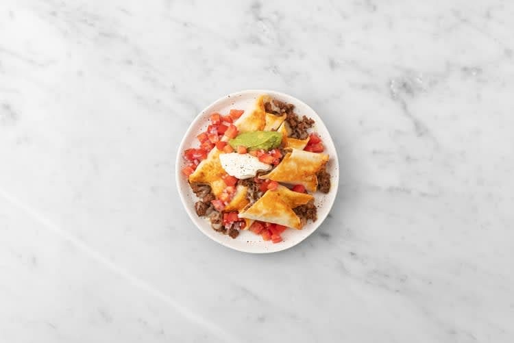 Divide Taquitos between plates. Dollop with guacamole, sour cream, and tomato salsa. Squeeze a lime wedge over top and serve.
