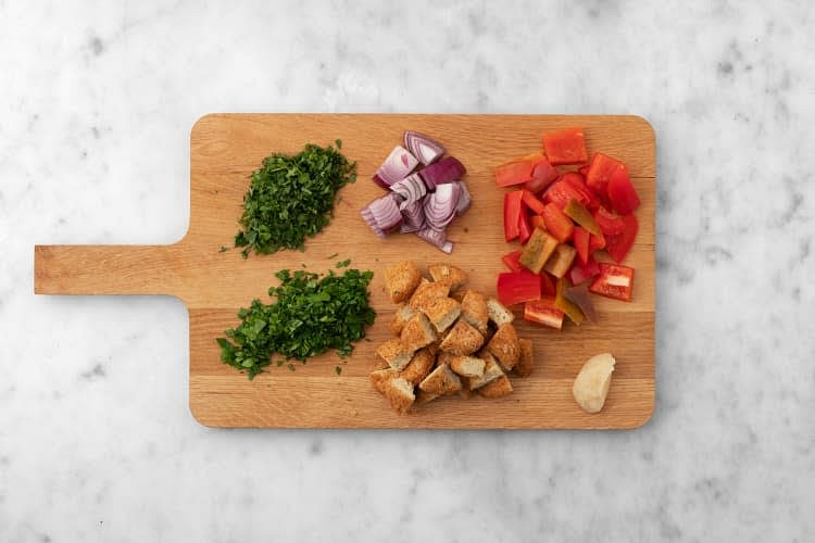Before starting, preheat the oven to 450˚F. Wash and dry all produce. Core, then cut pepper into 1/2-inch pieces. Halve, then peel onion. Cut into 1/2-inch pieces. Roughly chop spinach. Roughly chop parsley. Roughly chop cilantro. Cut falafel into quarters.
