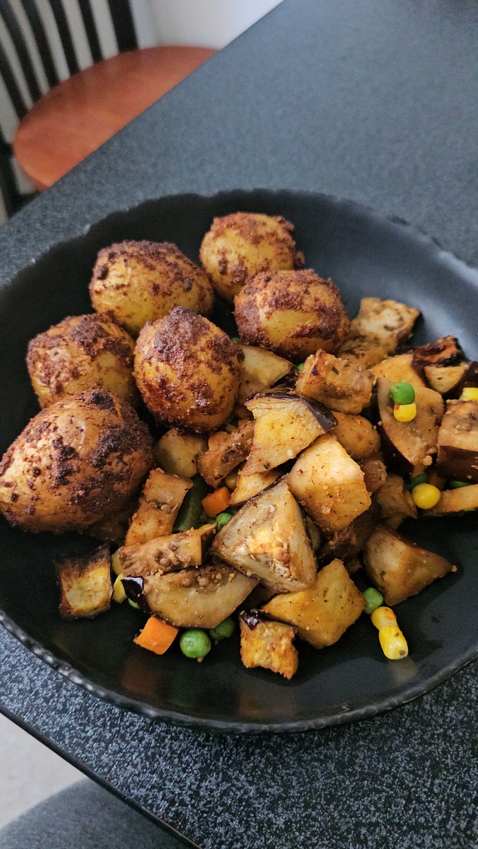 Cut up eggplant in cubes and add the black pepper and sazon and Italian seasoning and olive oil mix all together and put in air fryer for 25 mins at 360 degrees let cook I used a steamer bag of mixed veggies put in microwave for 5 mins mix veggies and eggplant