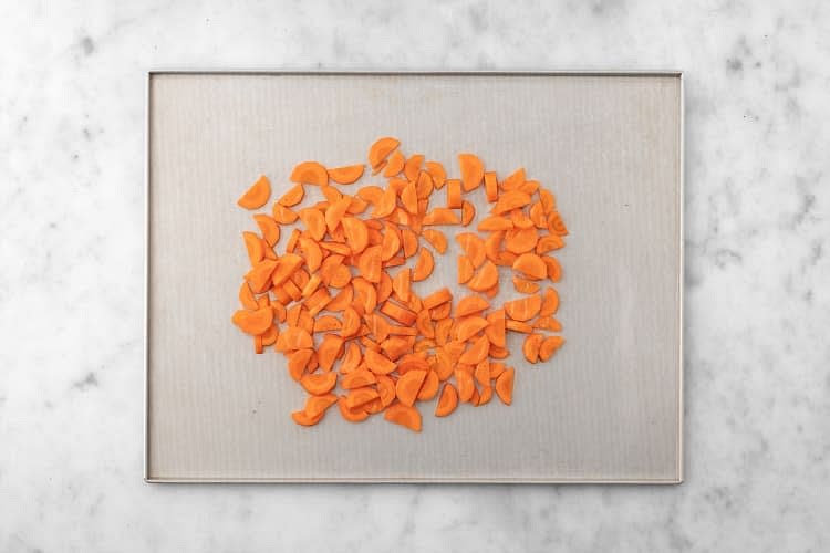 Add carrots and 1 tsp oil to an unlined baking sheet. Season with salt and pepper, then toss to combine. Roast in the top of the oven, stirring halfway through, until golden-brown, 18-20 min.