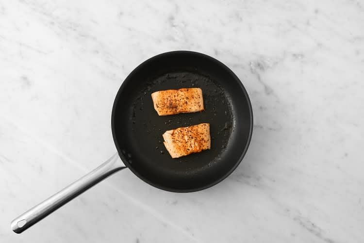 Heat a large non-stick pan over medium-high heat. While the pan heats, pat salmon dry with paper towels. Season with salt and 1/4 tsp Montreal Steak Spice. When the pan is hot, add 1/2 tbsp oil, then salmon, skin-side down. Cook until skin is crispy, 4-5 min. (TIP: Don't flip the fish too early; fish will release from the pan when the skin is crispy.) Flip and reduce heat to medium. Cook until salmon is opaque and cooked through (1-2 min, 158°F internal temp).