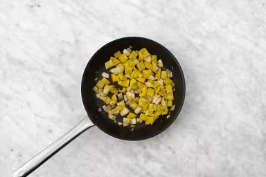 Heat a large non-stick pan over medium-high heat. When hot, add 1/2 tbsp oil, then onions and peppers. Cook, stirring occasionally, until veggies are tender-crisp, 3-4 min. Season with salt and pepper. Transfer veggies to a plate and cover to keep warm.