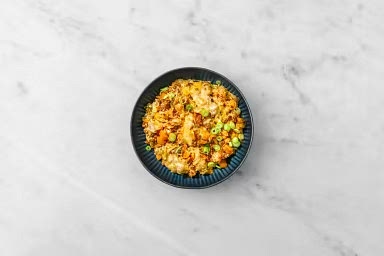 Divide beef and pork skillet rice between plates. Sprinkle green onions over top.