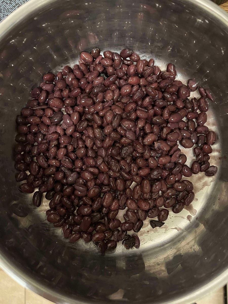 Drain the can of black beans and put in a large bowl or saucepan suitable for mashing