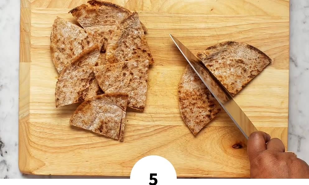 • Toast pitas until softened and warmed through. • Spread with softened butter, then cut each pita into quarters.