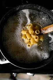 Cook pasta in salted water until al dente.