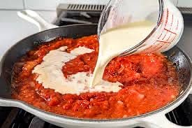 Once simmering, add the heavy cream. let it simmer more.