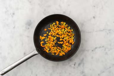 Heat a large non-stick pan over medium-high heat. When hot, add 1/2 tbsp oil, then peppers and carrots. Cook, stirring occasionally, until veggies begin to soften, 2-3 min. Add ginger. Cook, stirring often, until fragrant, 1 min. Transfer veggies to a plate, then cover to keep warm.