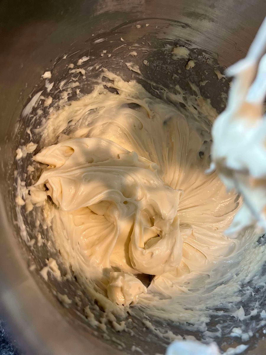 2. ﻿﻿Mix cream cheese, butter, vanilla, and powdered sugar together with an electric mixer - until mixture is fluffy and smooth.