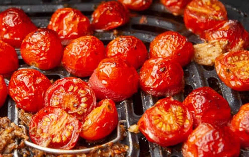 Drop the tomatoes inside the air fryer, drizzle with olive oil & sprinkle with coarse salt. Set the air frier to roast mode and roast for 5 minutes; toss them midway through the process. In the absence of an air fryer just you can roast them in a pan.