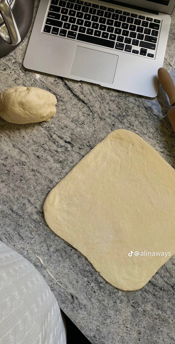 Mix milk with yeast until the yeast is dissolved. Then add flour, sugar, salt and egg. Beat on low speed for 3 - 5 minutes. Add cold butter bit by bit and beat for 5 more minutes.