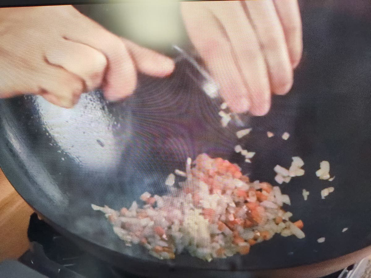 Add chopped garlic. Stir for 15 to 20 sec.