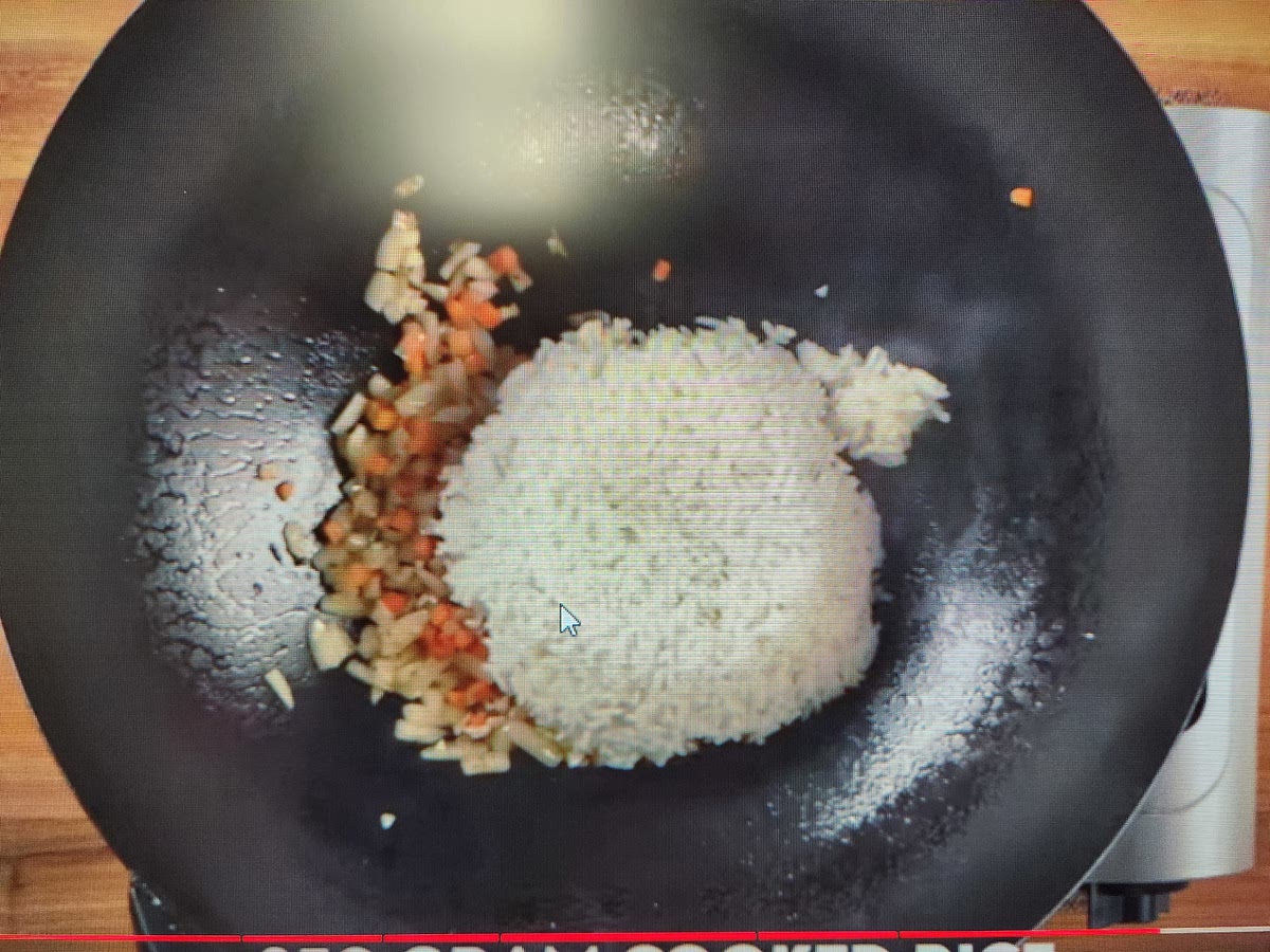 Add in rice and stir. Break up clumps. Continue for a few mins.