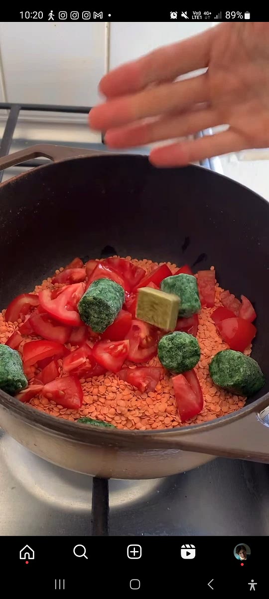 Add lentils, diced tomatoes, frozen spinach and a bouillon cube into a pot.