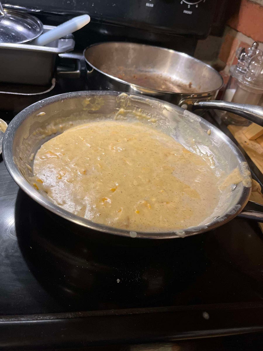 While pasta cooks, place flour, salt, and pepper in a large saucepan. Add milk, stirring with a whisk until well blended.