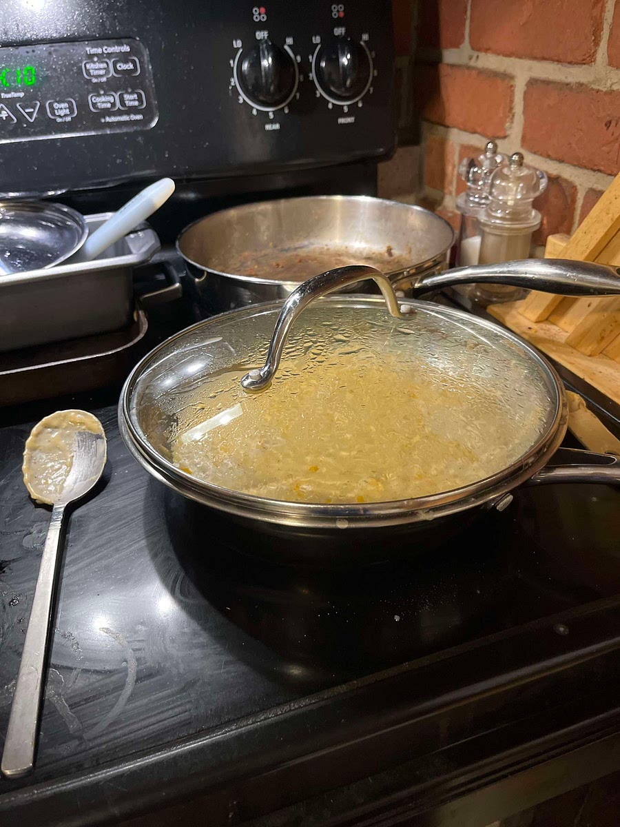 Drop cream cheese by teaspoonfuls into the milk mixture; bring it to a boil over medium-high heat, stirring constantly.