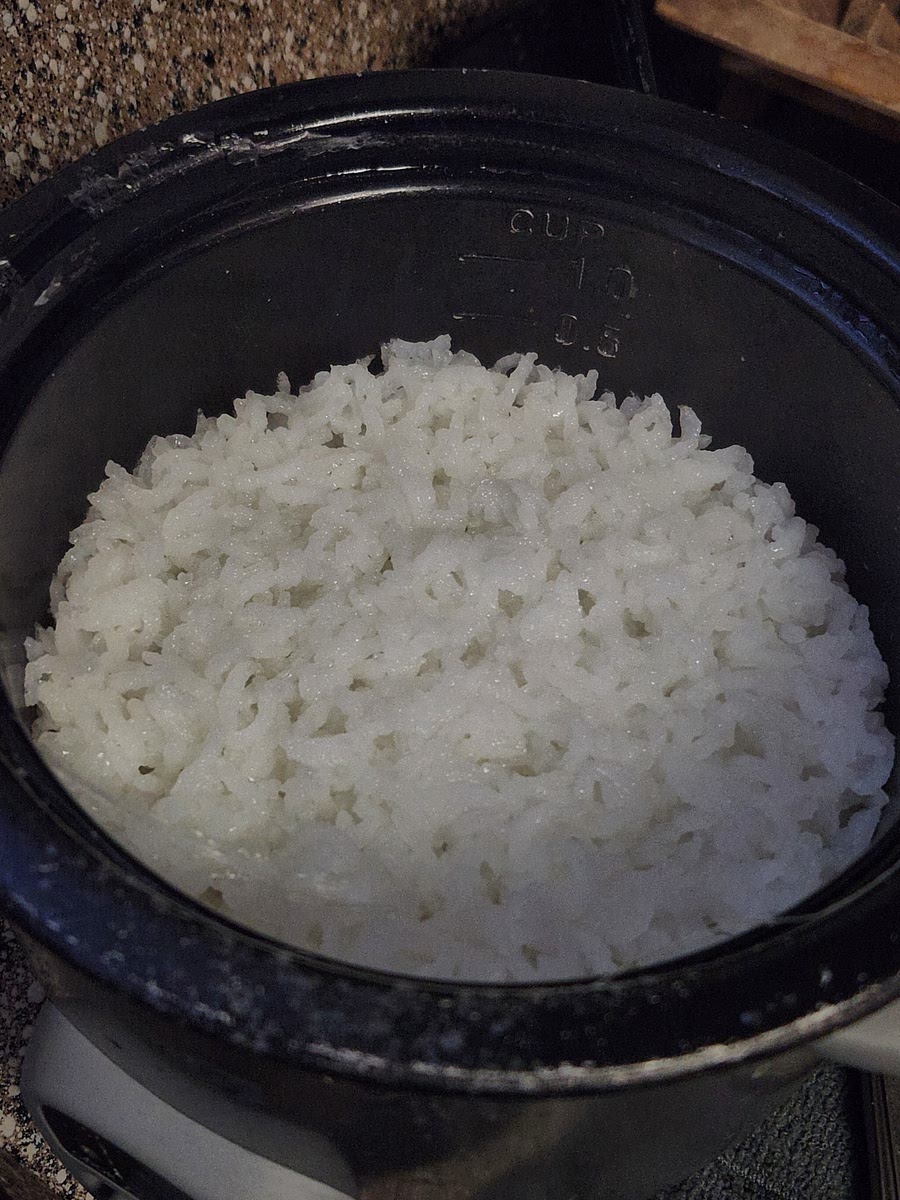 You start by prepping 1/2 cup of rice, and when that's done cooking you move on to the main part of the meal.