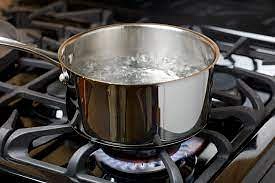 Pour some water into a pot and boil it with a pinch of salt